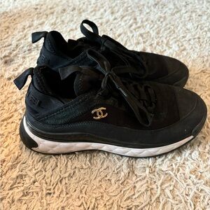 Women’s black fashion sneakers with Gold Decal CC size 7